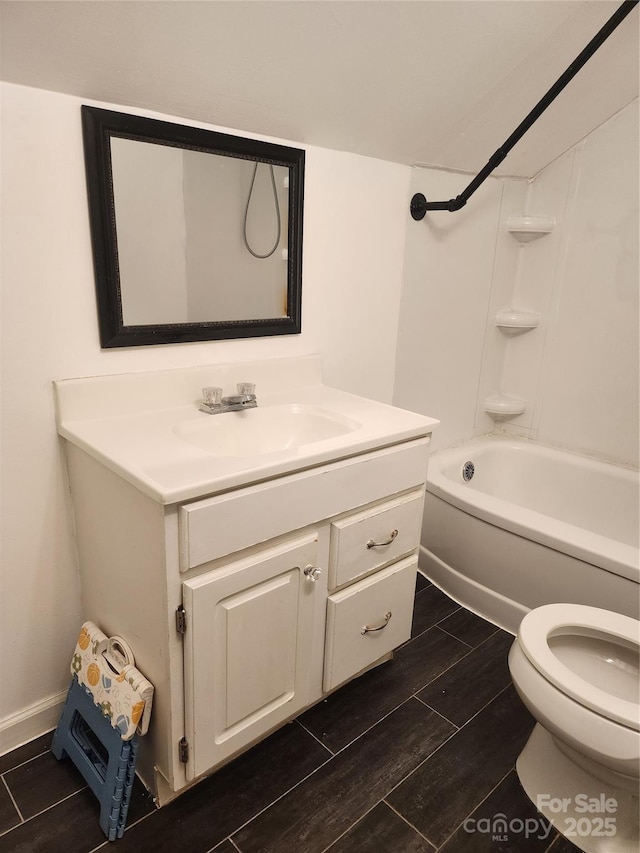 full bathroom with shower / bathing tub combination, vanity, and toilet