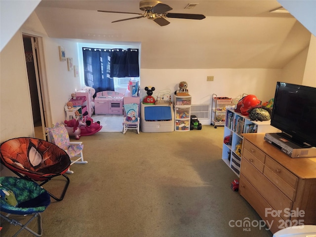 playroom featuring ceiling fan, carpet, and vaulted ceiling