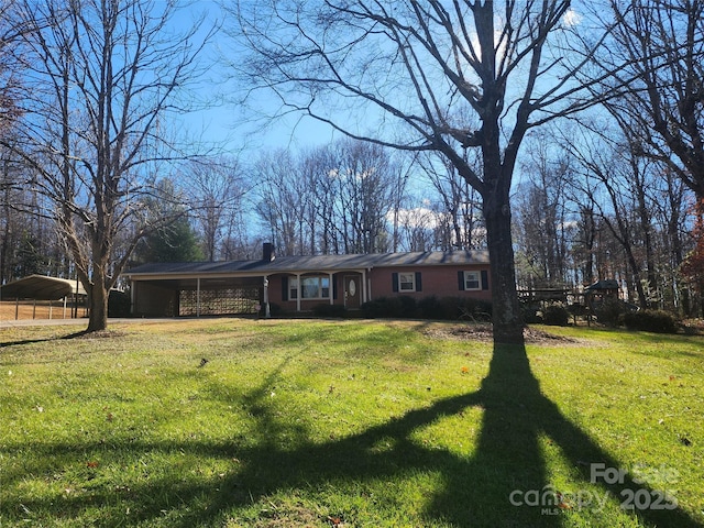 ranch-style home with a front lawn and a carport