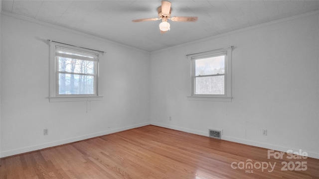 unfurnished room featuring light hardwood / wood-style flooring, ceiling fan, and crown molding