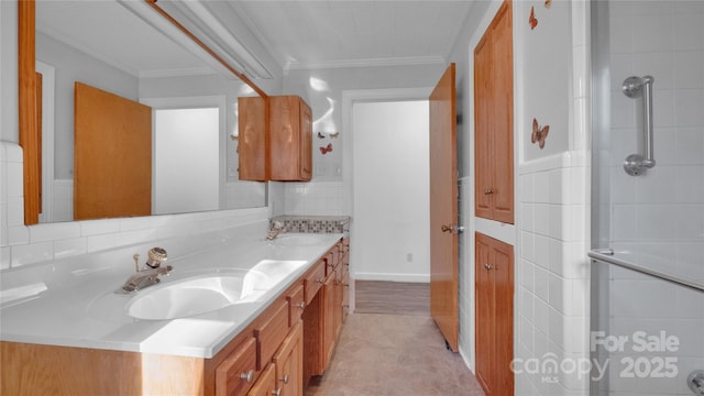 bathroom featuring vanity, a shower, and crown molding