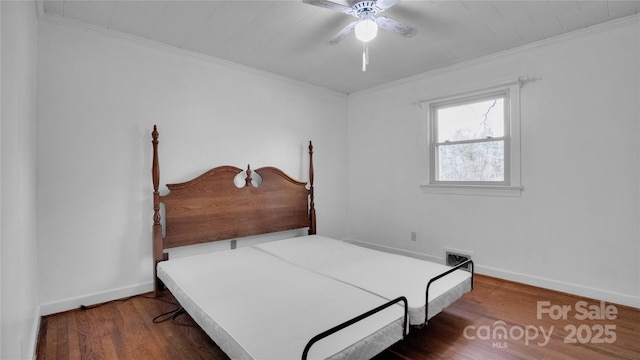 bedroom with ceiling fan, dark hardwood / wood-style floors, and ornamental molding