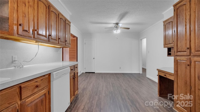 kitchen featuring white dishwasher, ceiling fan, ornamental molding, a textured ceiling, and dark hardwood / wood-style flooring