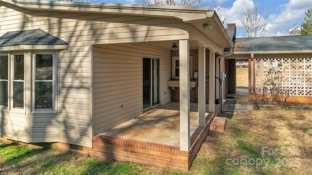 view of property exterior featuring a patio area