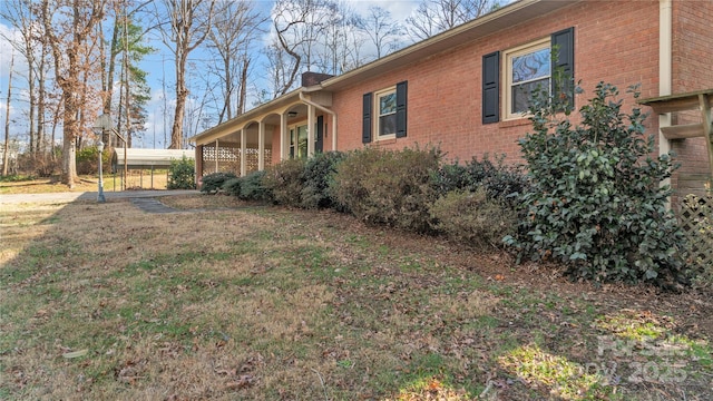 view of home's exterior with a yard