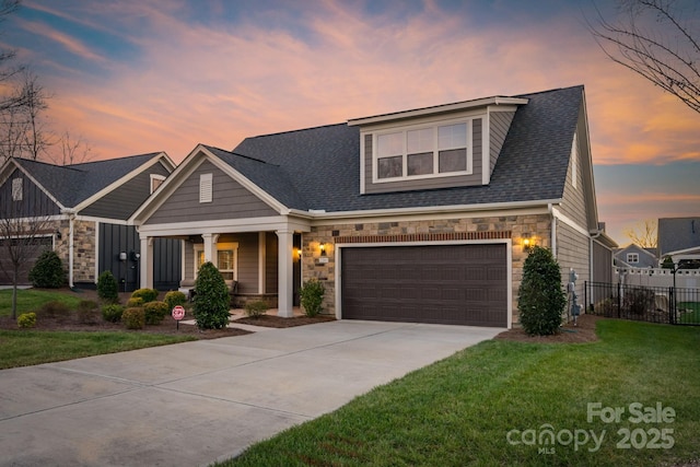 view of front facade featuring a lawn and a garage