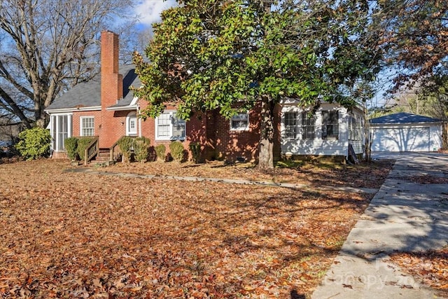 view of front of home with an outbuilding and a garage