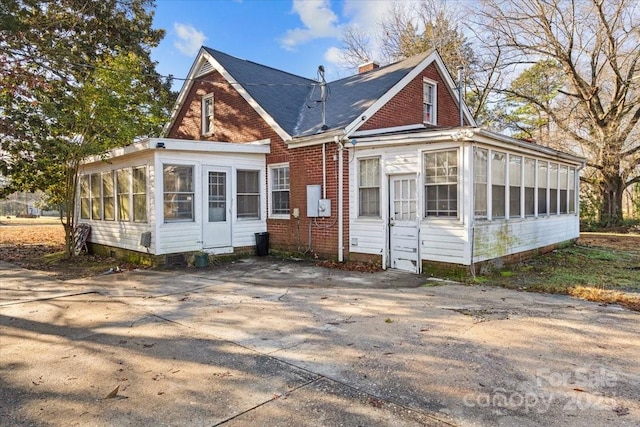 view of front of home with a sunroom