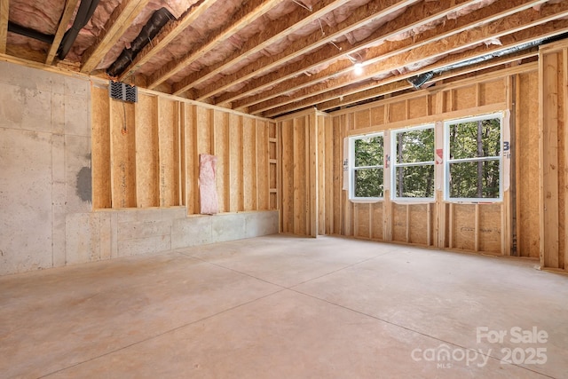 misc room with concrete flooring