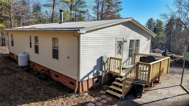 back of property featuring a deck