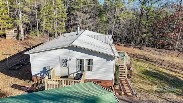 back of property featuring a deck