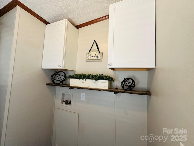 room details featuring ornamental molding and a textured ceiling