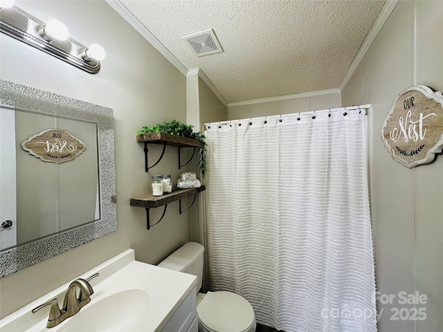 bathroom featuring vanity, a textured ceiling, toilet, and crown molding