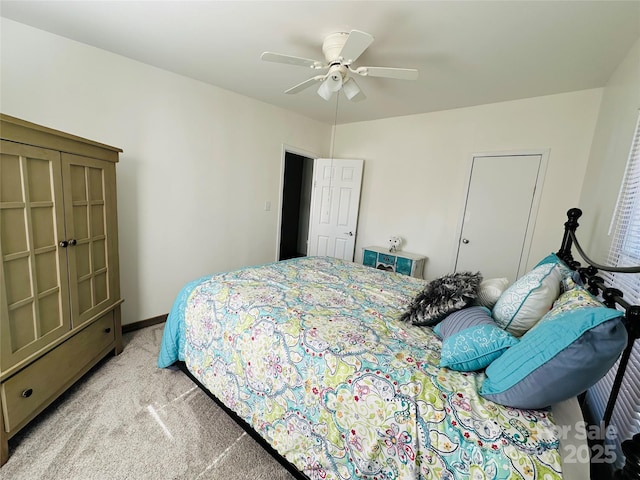 bedroom featuring light colored carpet and ceiling fan