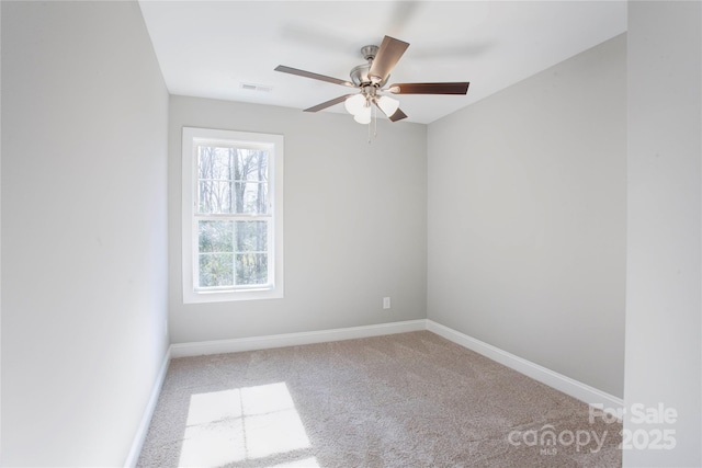 empty room with carpet floors and ceiling fan