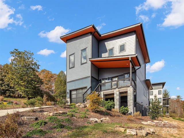 view of front of house featuring central AC and a garage