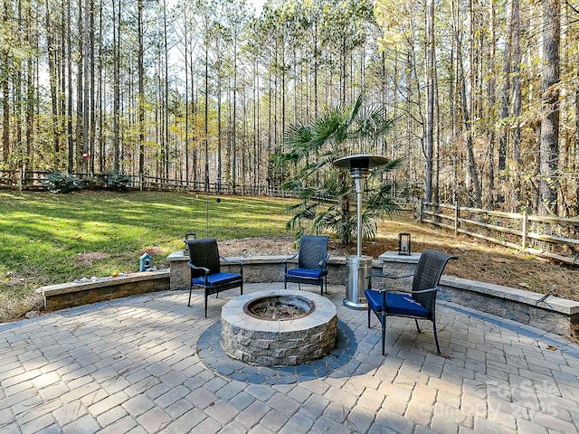 view of patio with an outdoor fire pit