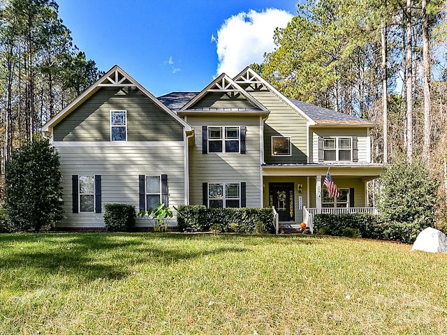 view of front of home featuring a porch and a front yard