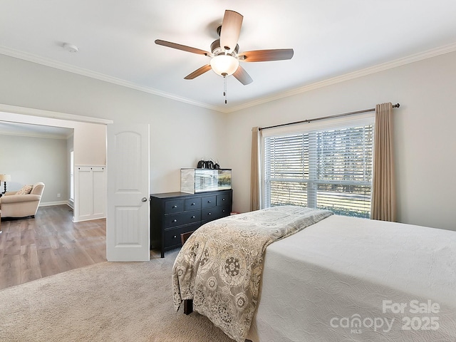 bedroom featuring ceiling fan and ornamental molding