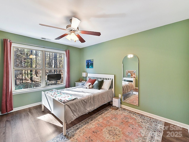 bedroom with wood-type flooring and ceiling fan