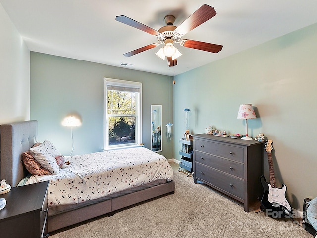 bedroom featuring ceiling fan and light colored carpet