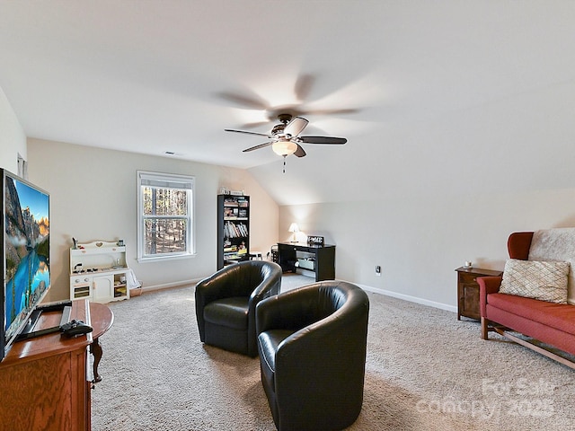 living room featuring ceiling fan, carpet, and vaulted ceiling