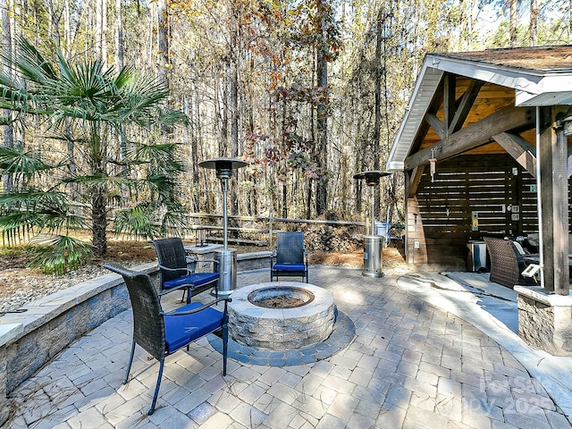 view of patio with a fire pit