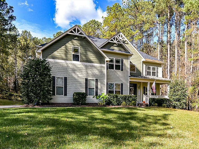 view of front facade featuring a porch and a front yard