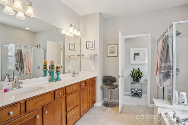 bathroom with tile patterned floors, vanity, walk in shower, and a chandelier