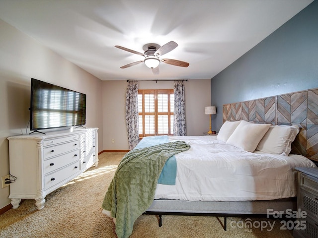 bedroom featuring light colored carpet and ceiling fan