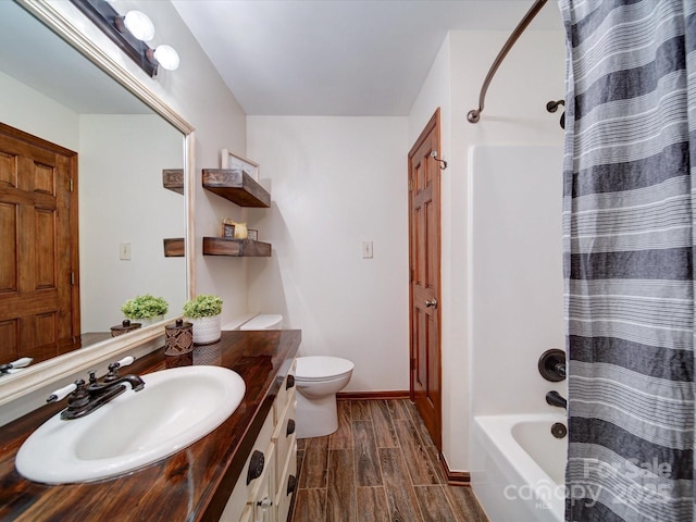 full bathroom featuring vanity, shower / tub combo with curtain, and toilet