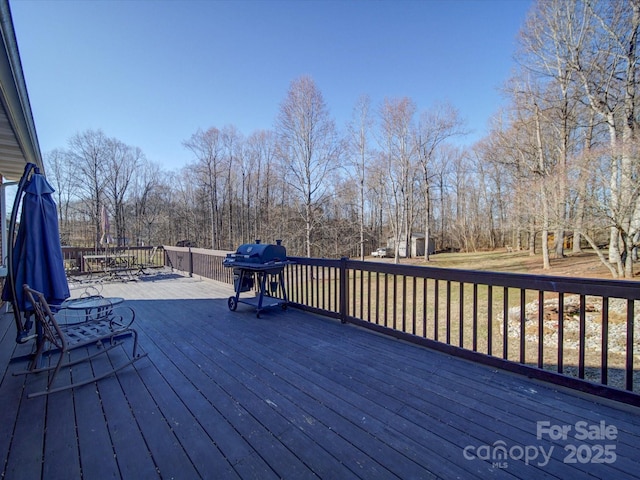 wooden deck with grilling area