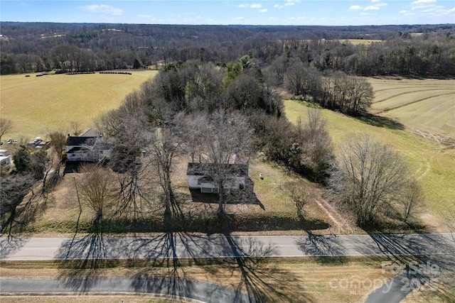 birds eye view of property with a rural view