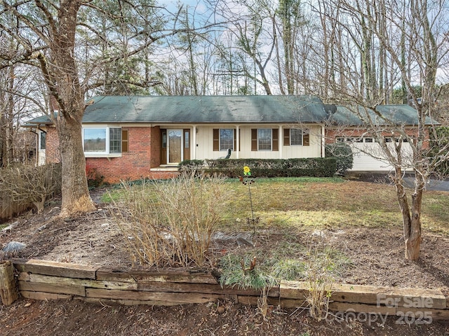 ranch-style house featuring a garage