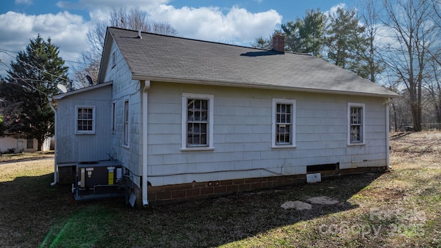 view of side of property with central AC unit