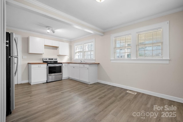 kitchen featuring stainless steel appliances, white cabinetry, crown molding, and light hardwood / wood-style flooring