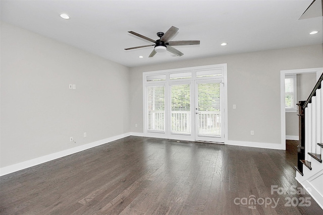 unfurnished living room featuring dark hardwood / wood-style floors and ceiling fan