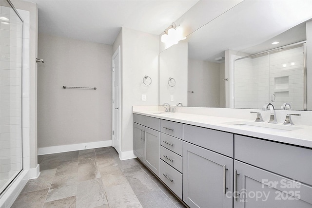 bathroom featuring vanity and a shower with shower door