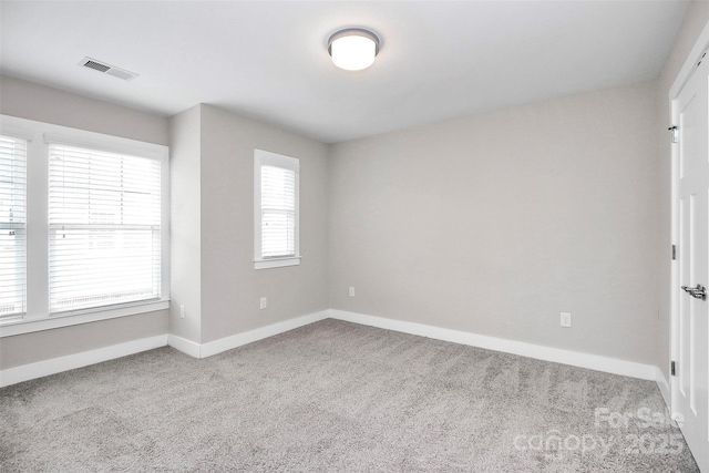 spare room with light carpet