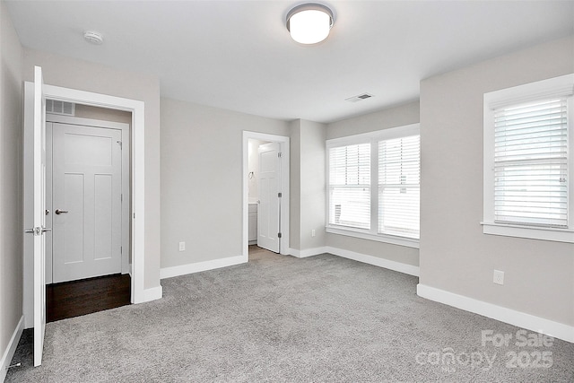 unfurnished bedroom featuring light colored carpet