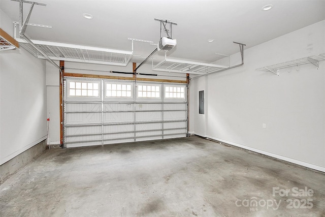 garage with electric panel and a garage door opener