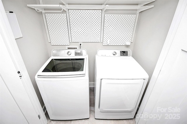 washroom with independent washer and dryer