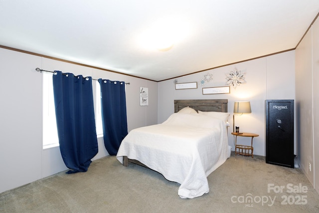 carpeted bedroom featuring ornamental molding