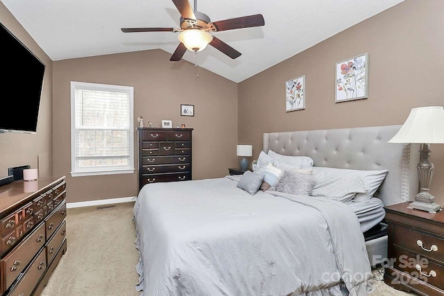 carpeted bedroom with lofted ceiling and ceiling fan