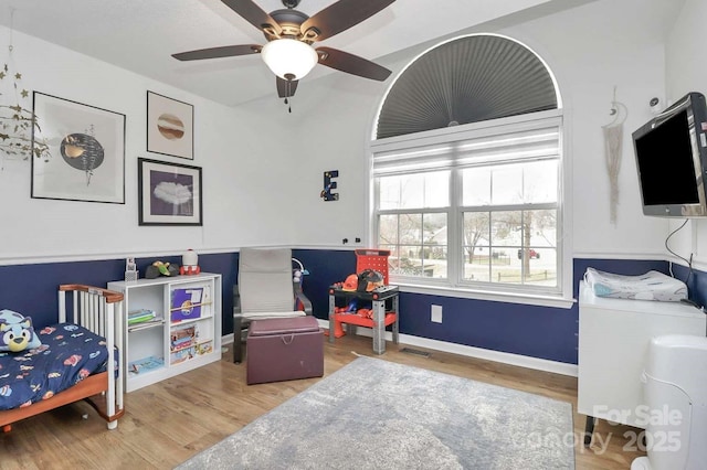 bedroom featuring light hardwood / wood-style floors and ceiling fan