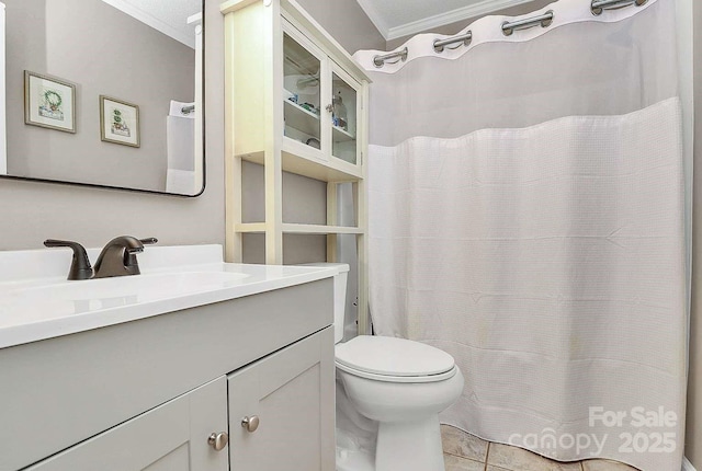 bathroom with vanity, tile patterned floors, ornamental molding, and toilet