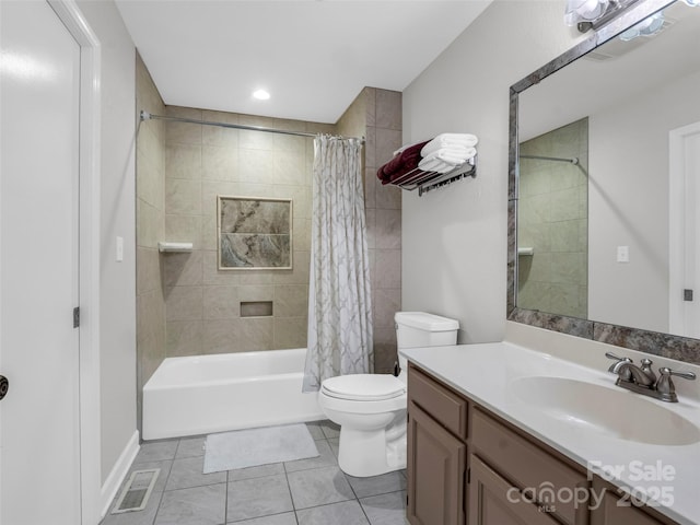 full bathroom with tile patterned flooring, shower / tub combo with curtain, vanity, and toilet