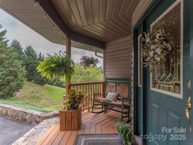 wooden deck featuring a porch