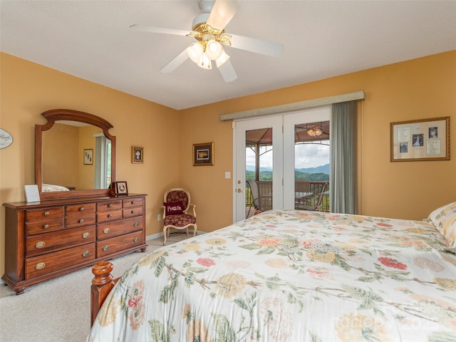 carpeted bedroom featuring ceiling fan and access to exterior