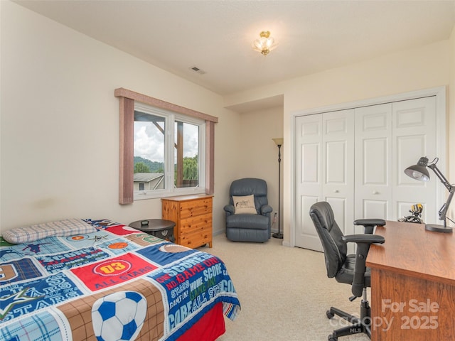 bedroom with a closet and carpet